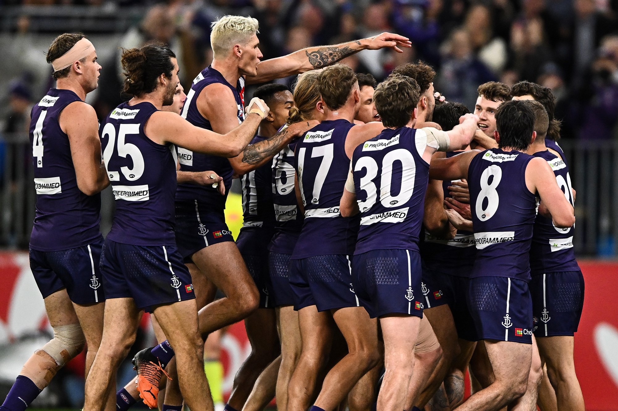 Dockers players celebrate together