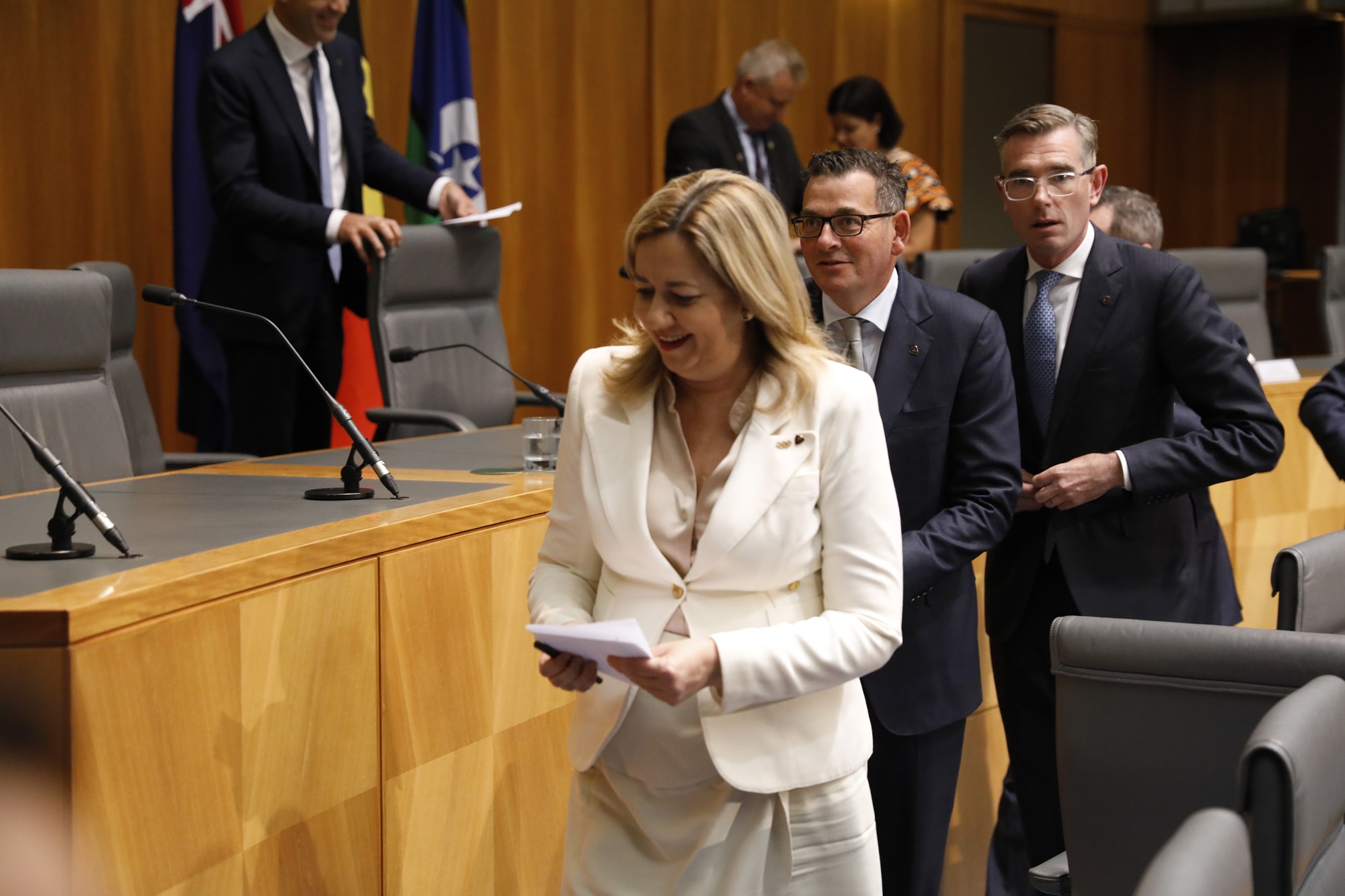 Annastacia Palaszczuk, Dan Andrews and Dominic Perrottet leave a meeting.