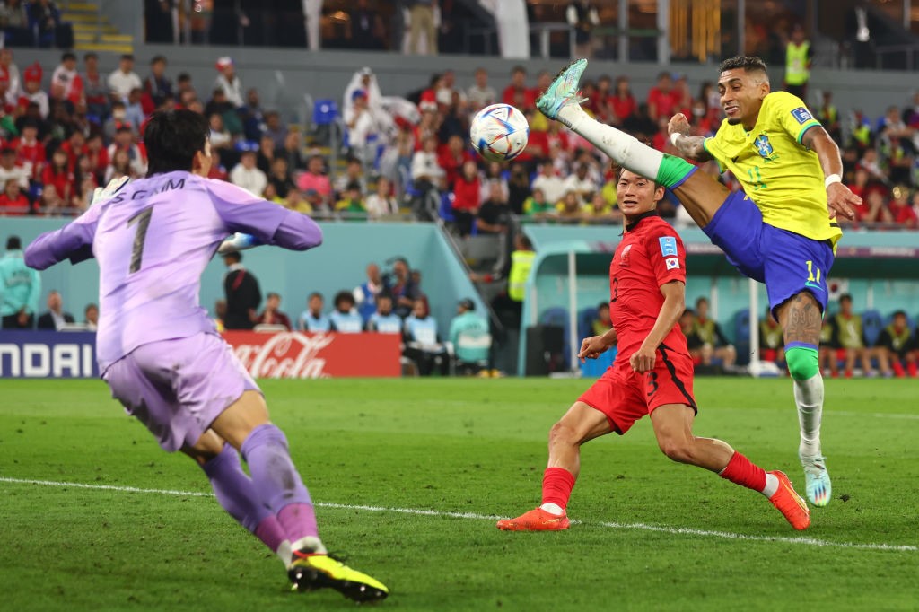 Raphinha of Brazil misses the ball with a high foot during the Qatar World Cup match against South Korea.