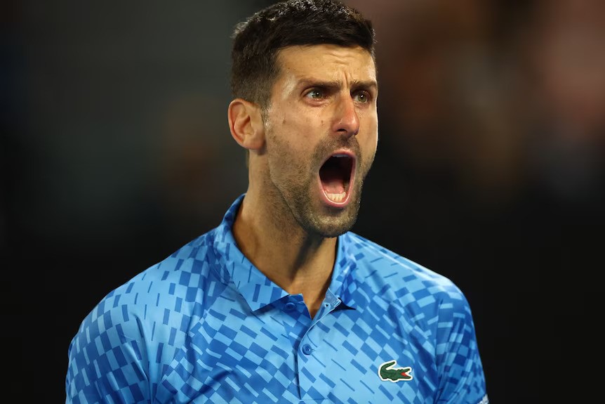 Novak Djokovic roars.