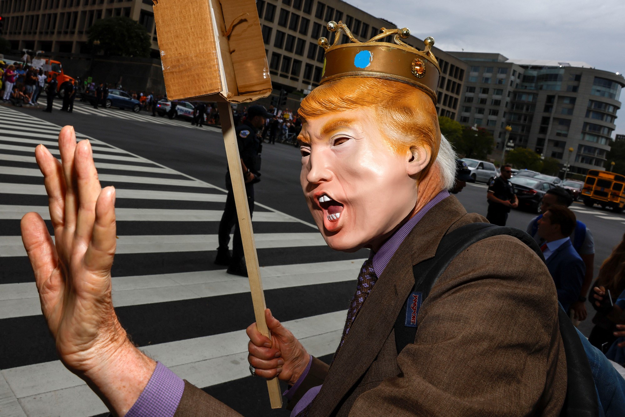 A demonstrator gestures on the day former U.S. President Donald Trump, who is facing federal charges related to attempts to overturn his 2020 election defeat, appears at the U.S. District Court in Washington, U.S.