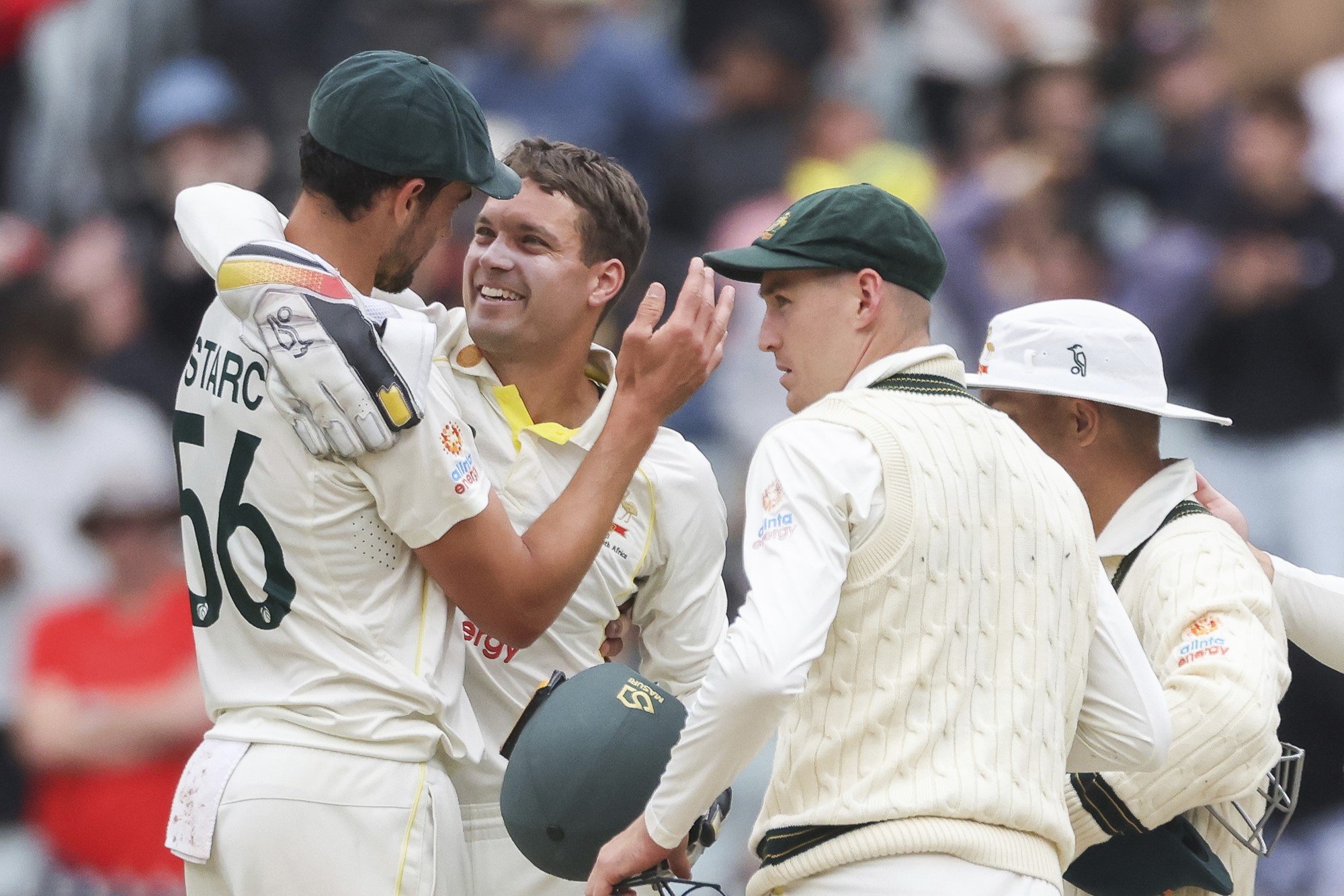 Mitchell Starc and Alex Carey hug after Australia beats South Africa in the Boxing Day Test at the MCG.