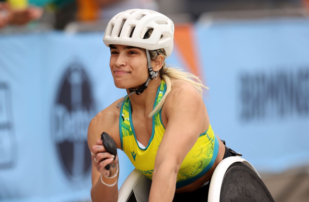 Madison de Rozario smiles in her racing wheelchair