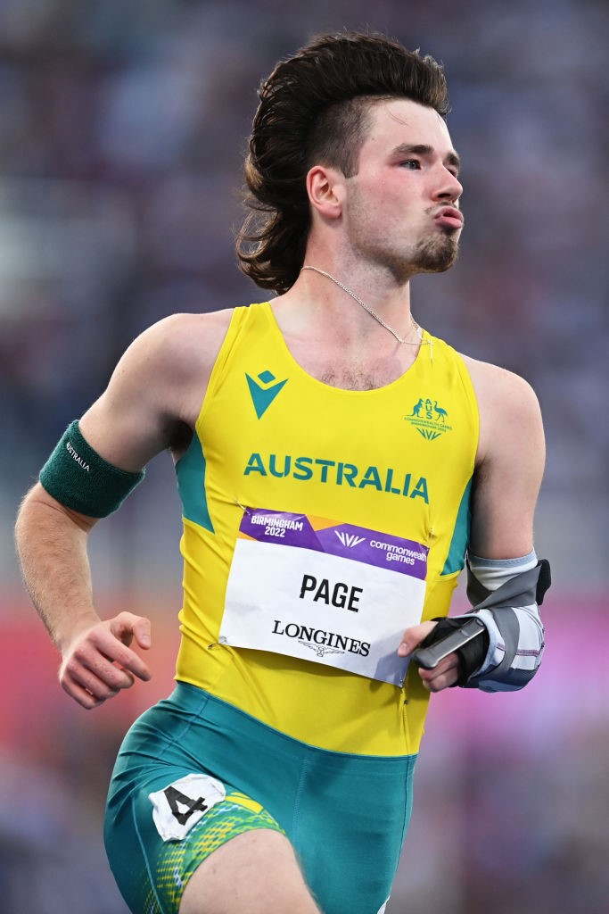 jaydon page runs on a track with his mullet flowing in the breeze