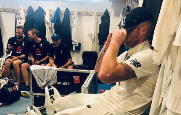 England cricketer Ben Stokes sits in the change rooms with his cap over his eyes after a Test.