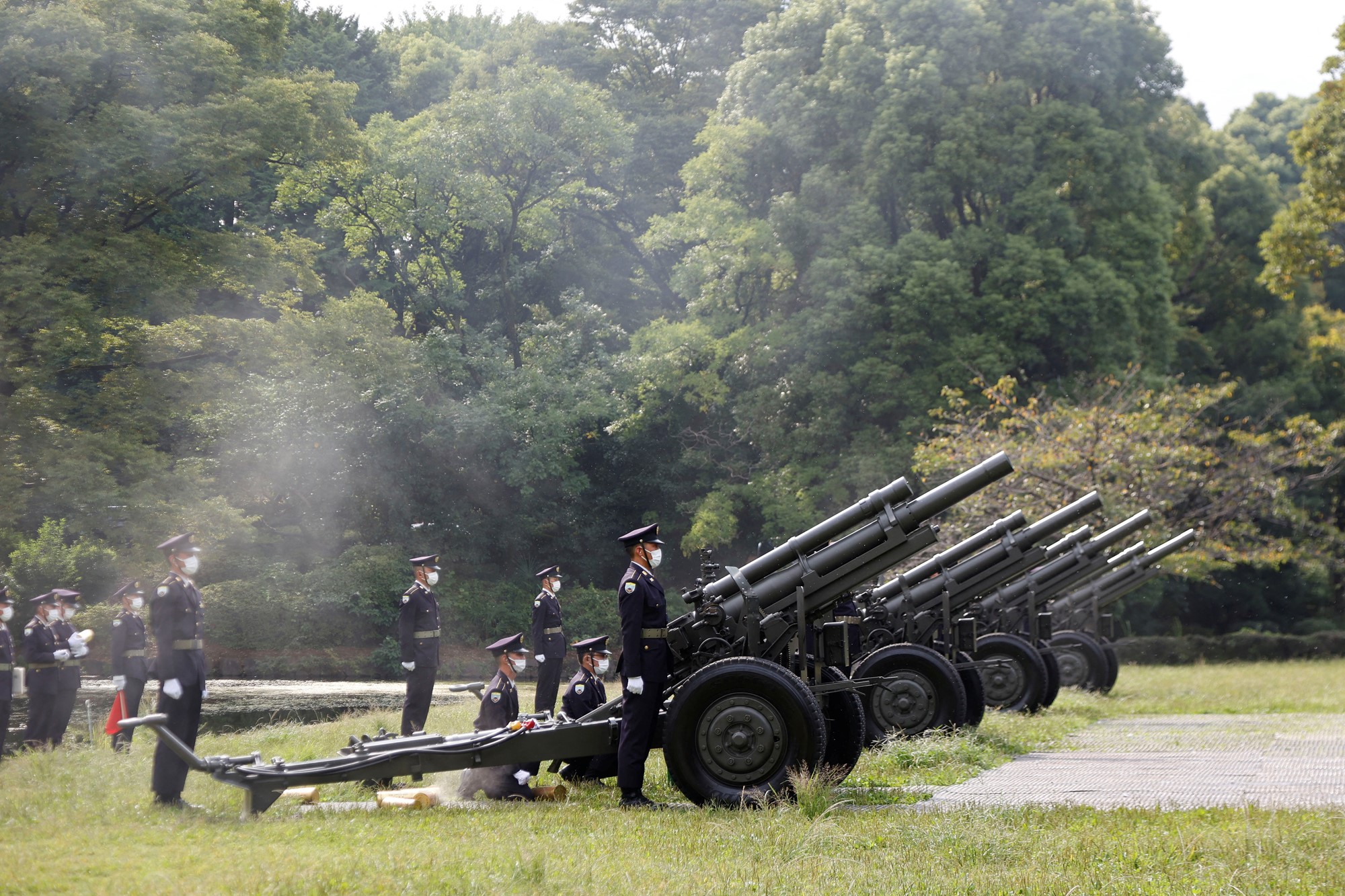 Japanese Ground Self-Defense Force personnel fire cannons at the Budokan grounds for the State Funeral 