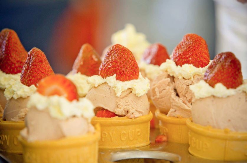 A close up of strawberry sundaes 