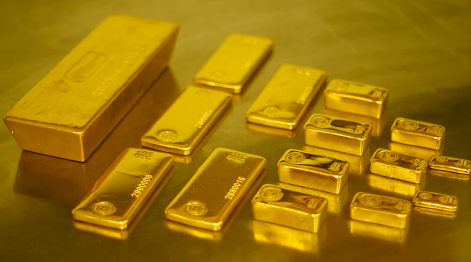 Gold bars laid out on a table.