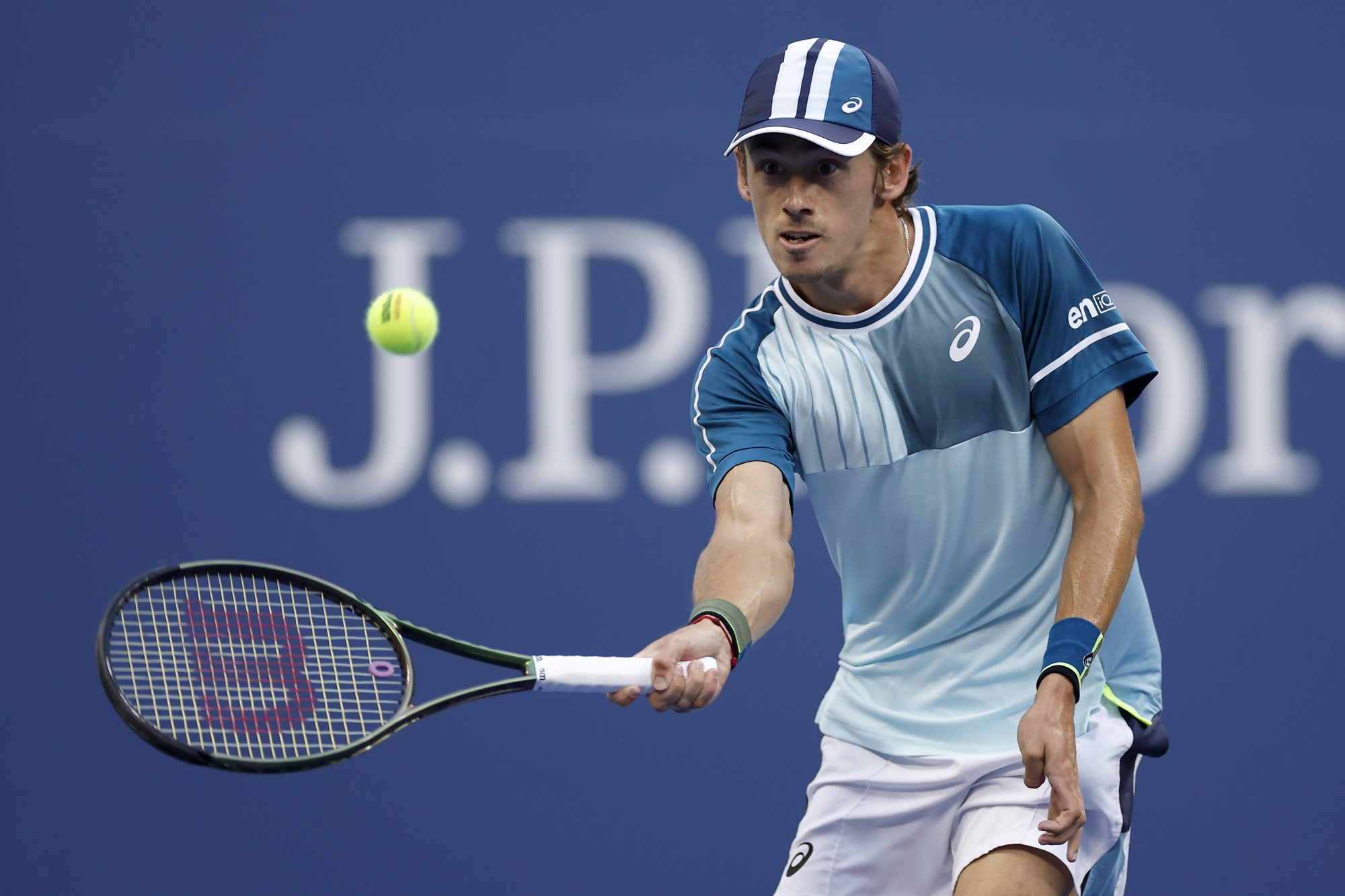 Alex de Minaur plays a forehand volley at the US Open.