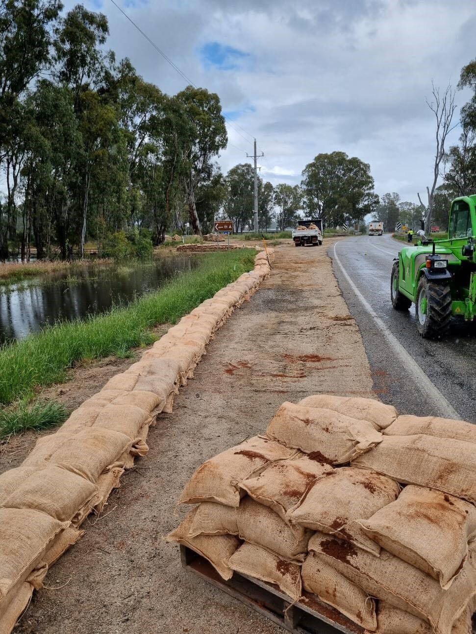 Sandbags are stacked in a levee.