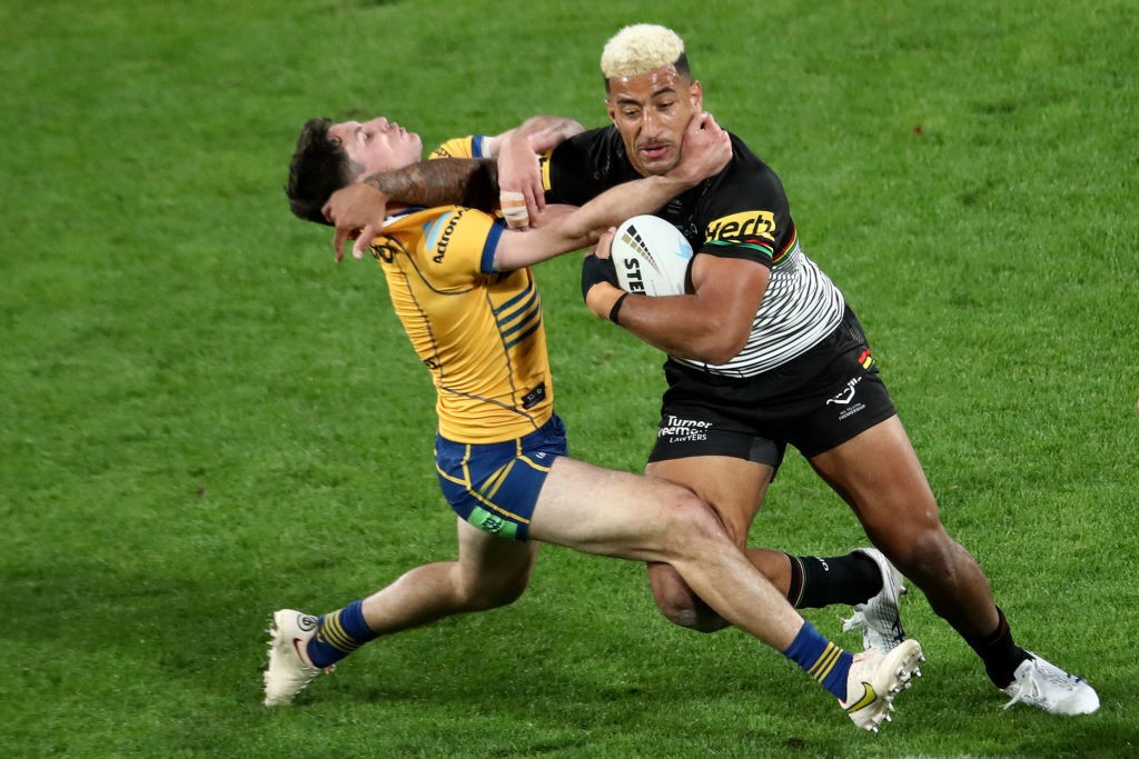 Parramatta Eels' Mitchell Moses tries to tackle Penrith Panthers' Viliame Kikau in the NRL grand final.