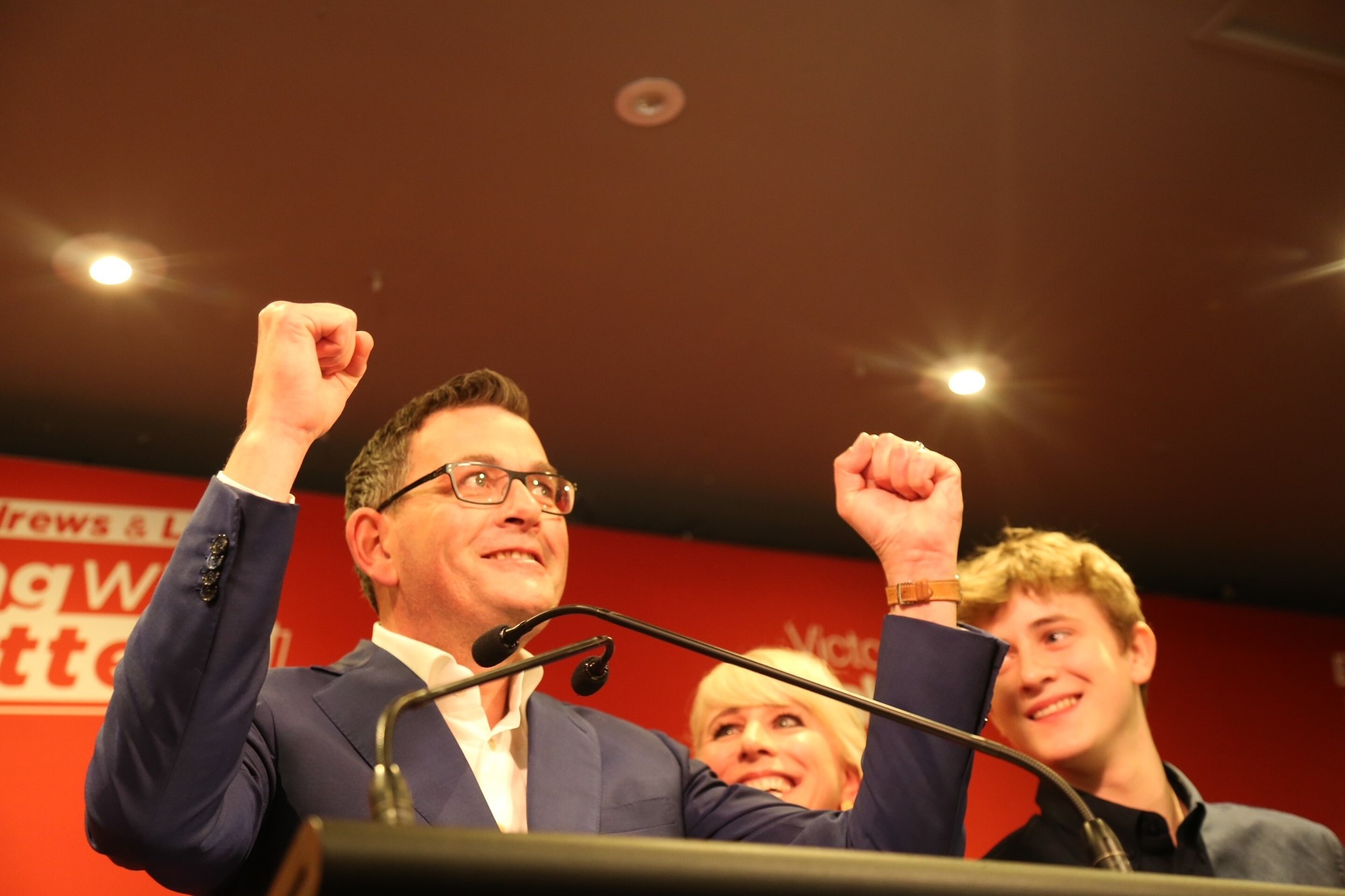 Daniel Andrews holds up his fists in celebration.