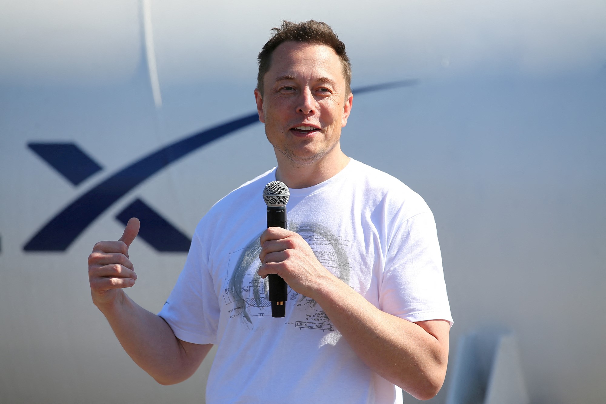 Elon Musk talking into a microphone