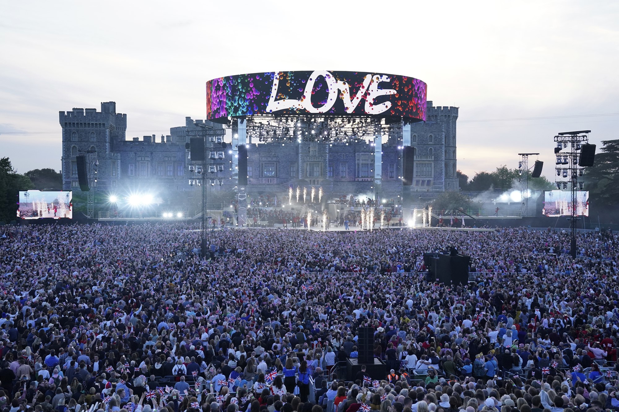 A crowd of thousands in font of a stage.