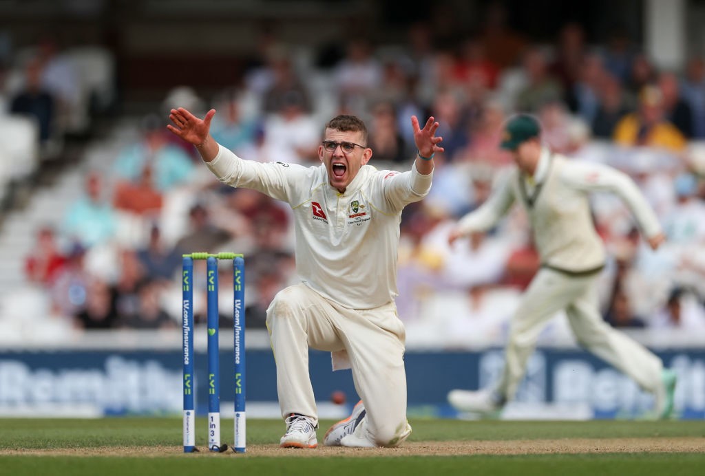 Australia bowler Todd Murphy shouts with both arms extended during an Ashes Test.