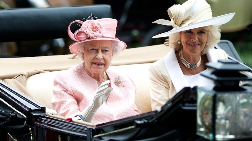 Queen Elizabeth II and Camilla in an open top carriage