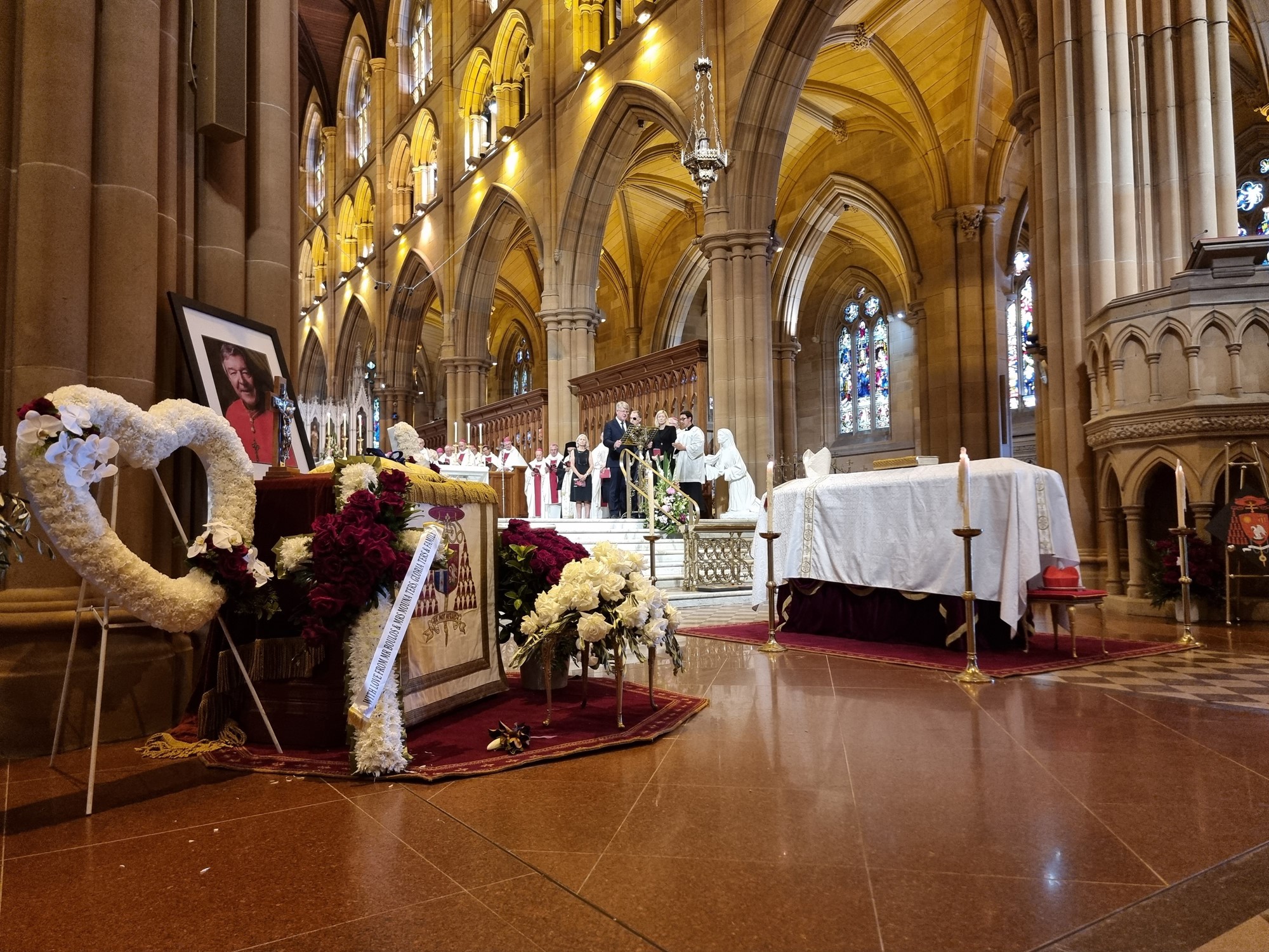 A photo of George Pell on a table near his coffin.
