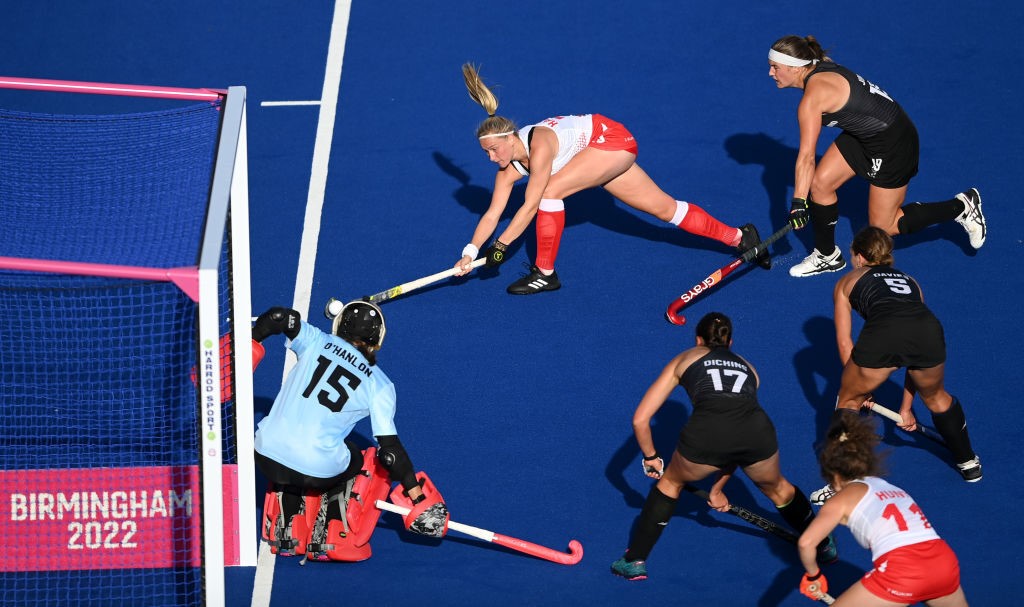 A scene from a hockey match as England attacks the New Zealand goal