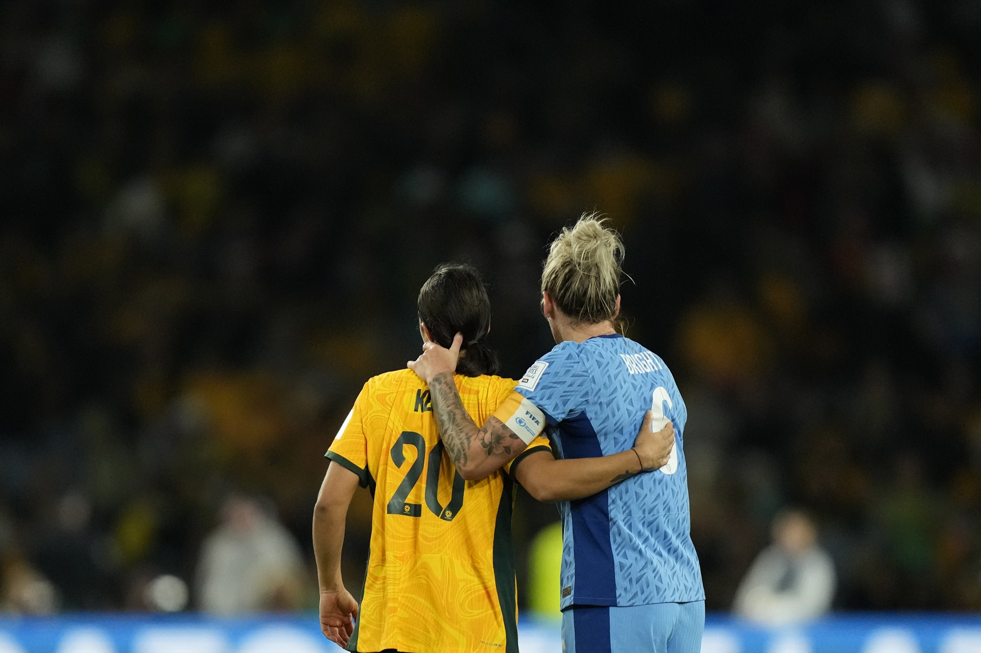 Australia's Sam Kerr and England's Millie Bright put their arms around each other