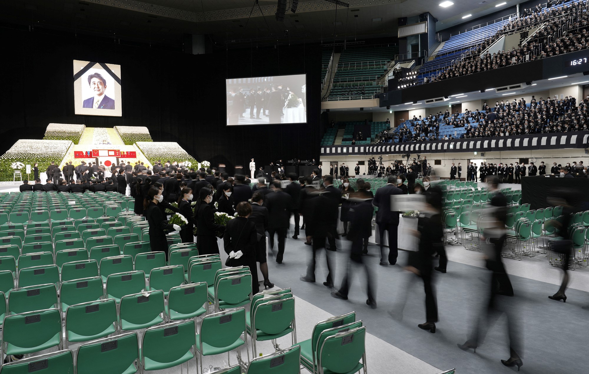 Mourners line up to pay their respects during the state funeral of former Japanese Prime Minister Shinzo Abe 