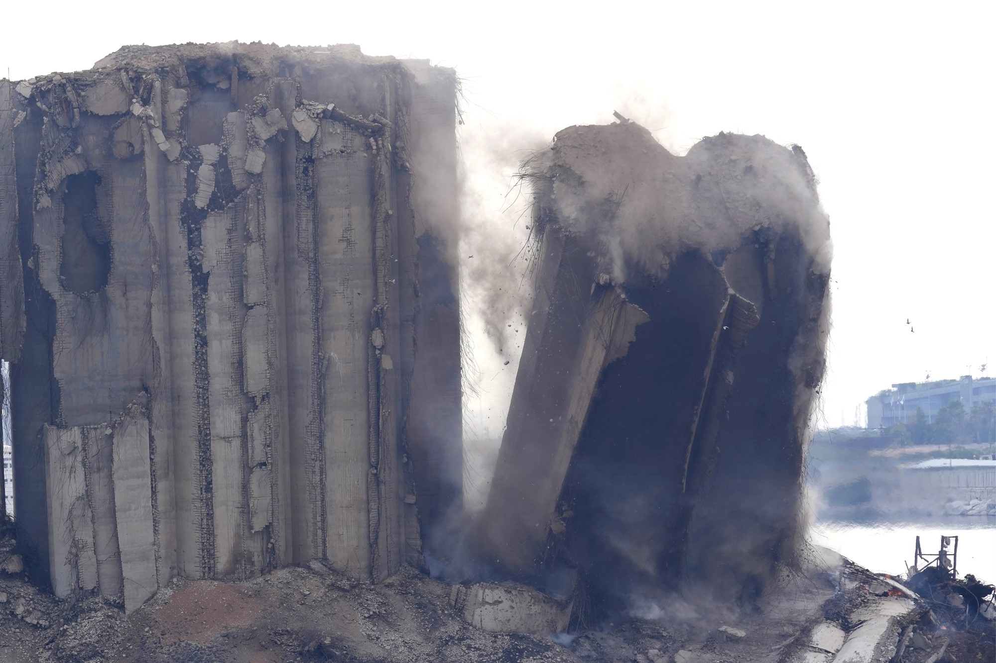 A left part of the silos damaged during the August 2020 massive explosion in the port is seen collapsing, in Beirut, Lebanon