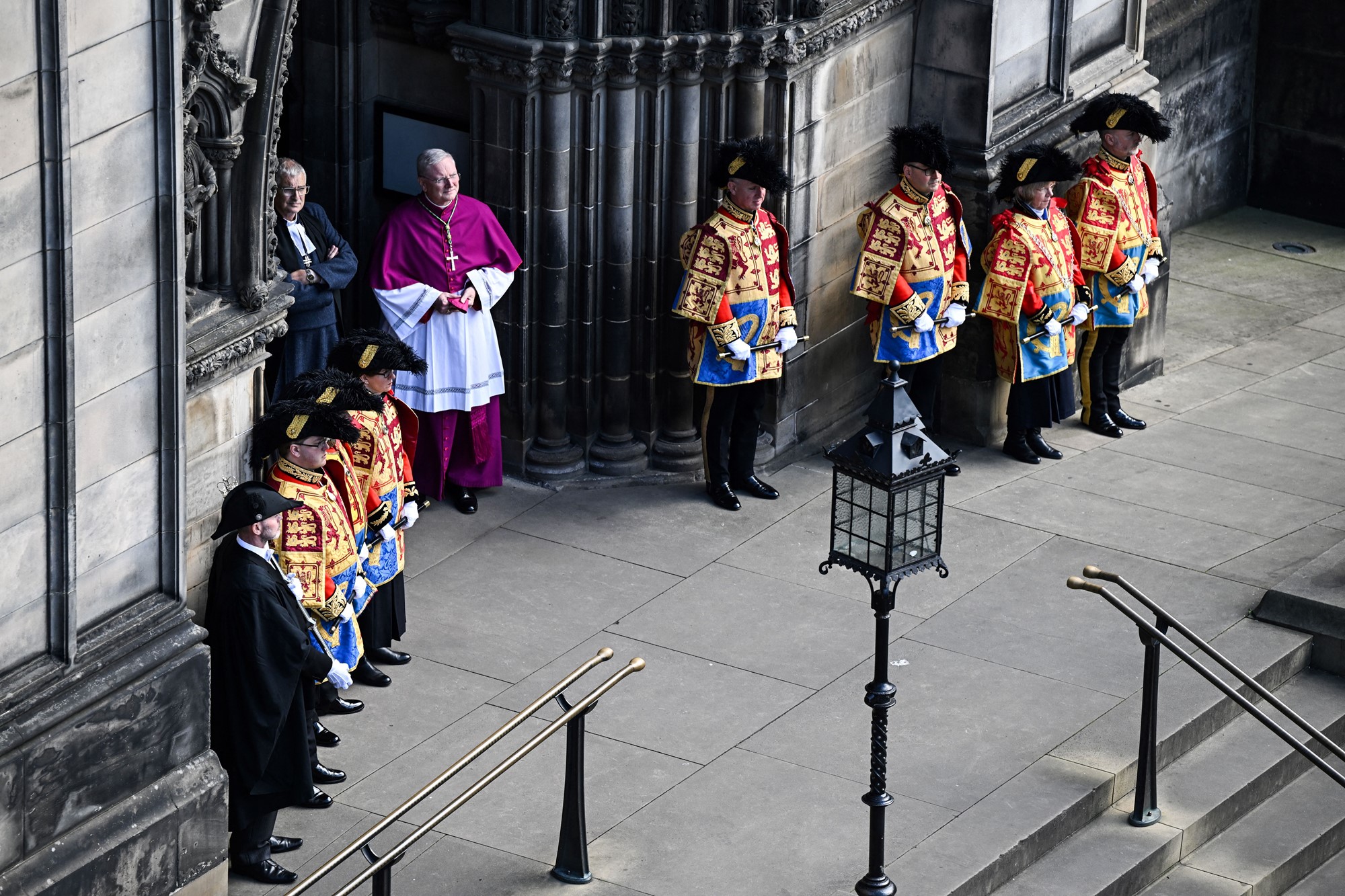 Heralds and Pursuivants of Scotland stand outside the entrance to St Giles' Cathedral, in Edinburgh, on September 12, 2022, ahead of a service of Thanksgiving for the life of Queen Elizabeth II.