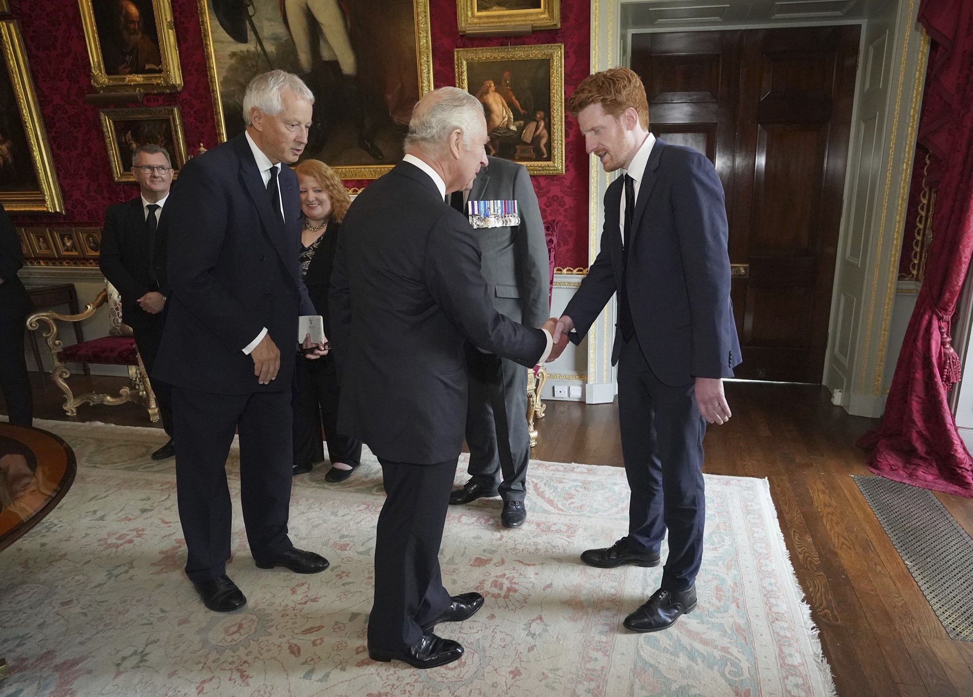 Britain's King Charles III meets with SDLP MLA Matthew O'Toole at Hillsborough Castle, Belfast, Tuesday Sept. 13, 2022.