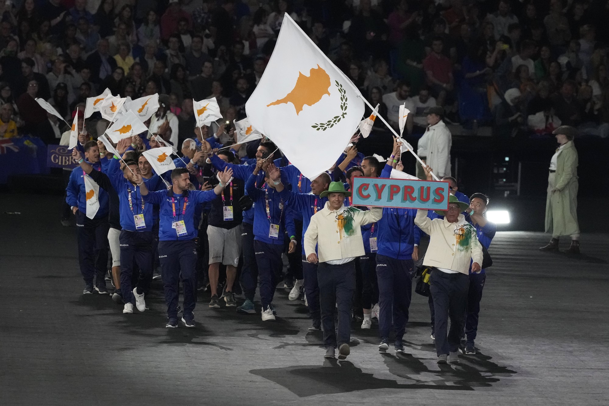 People march behind the Cyprus flag