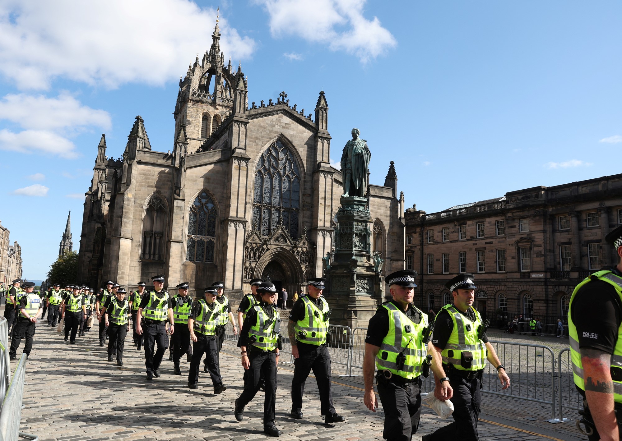 Police officers walk past St Giles Cathedral, following the death of Britain's Queen Elizabeth, in Edinburgh, Scotland, Britain, September 13, 2022