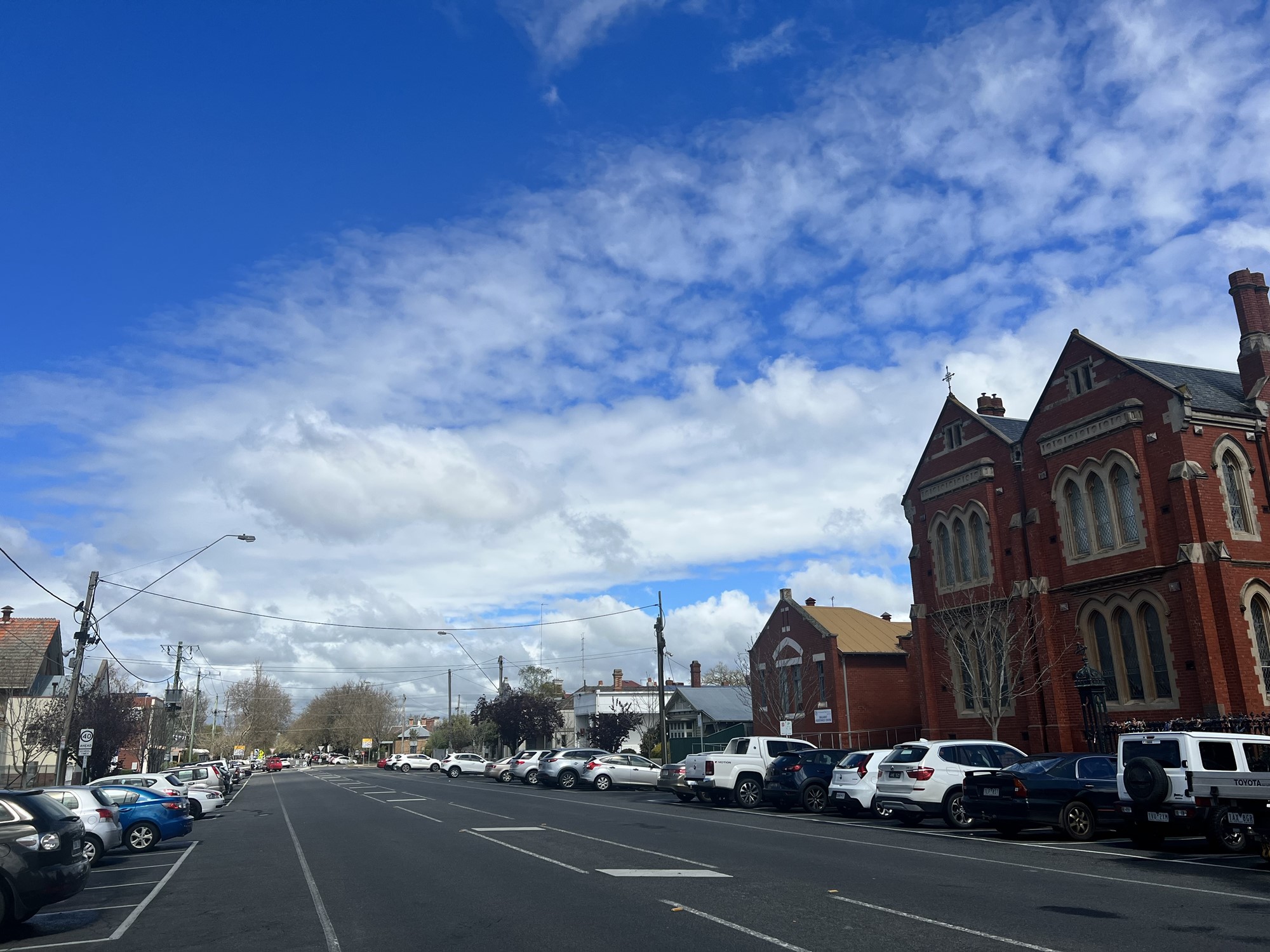 Blue skies over a street