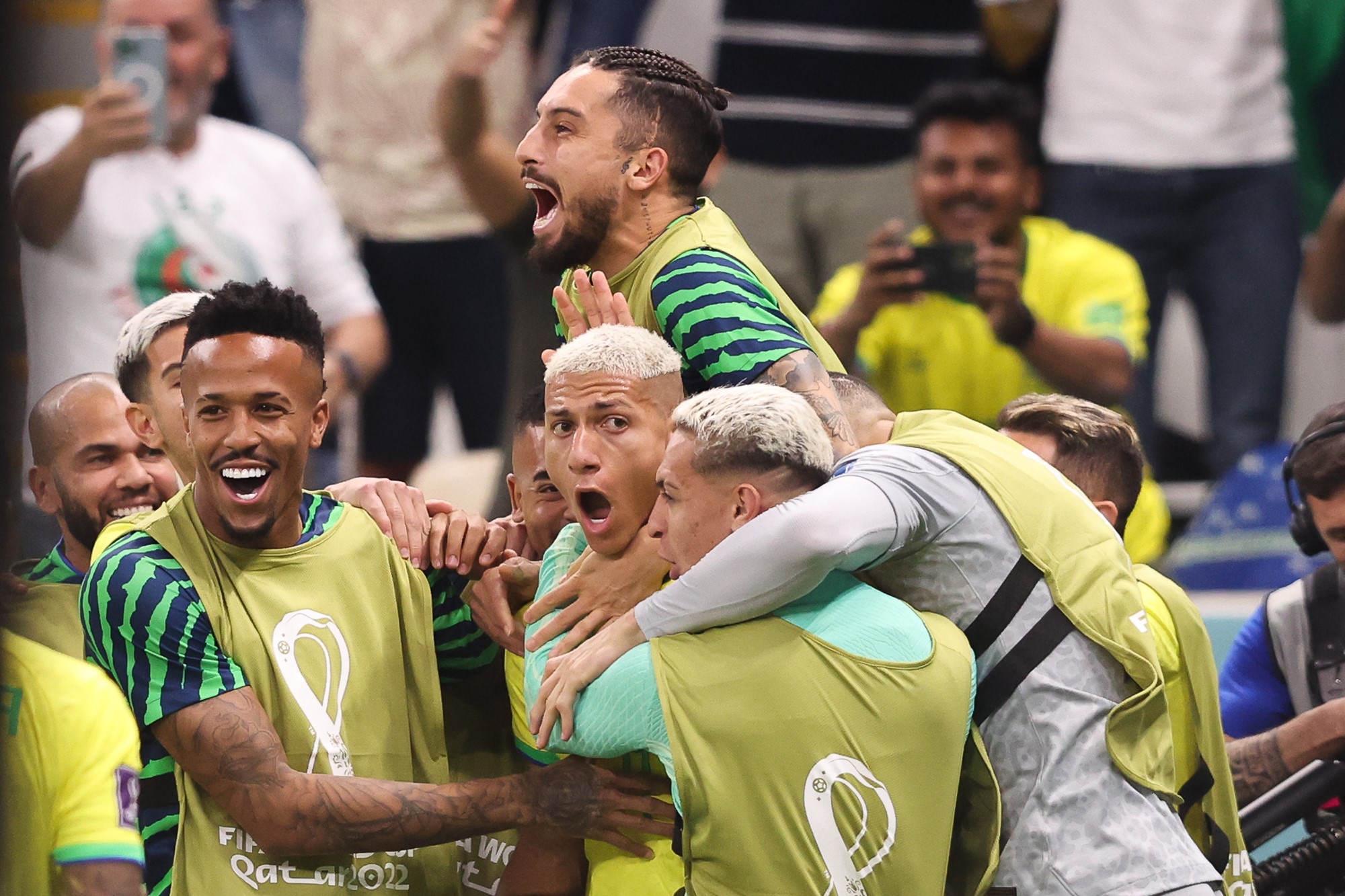 Brazilian players celebrate on the sidleline