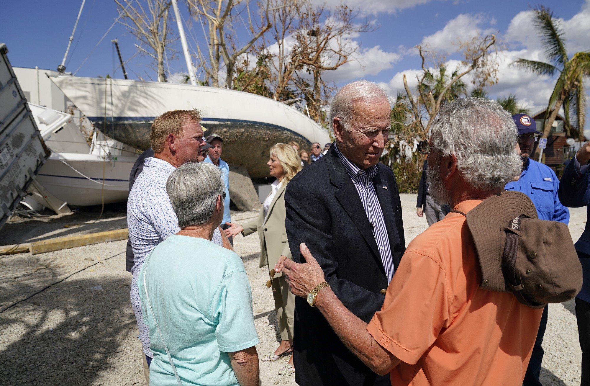 Biden shakes hands with locals.