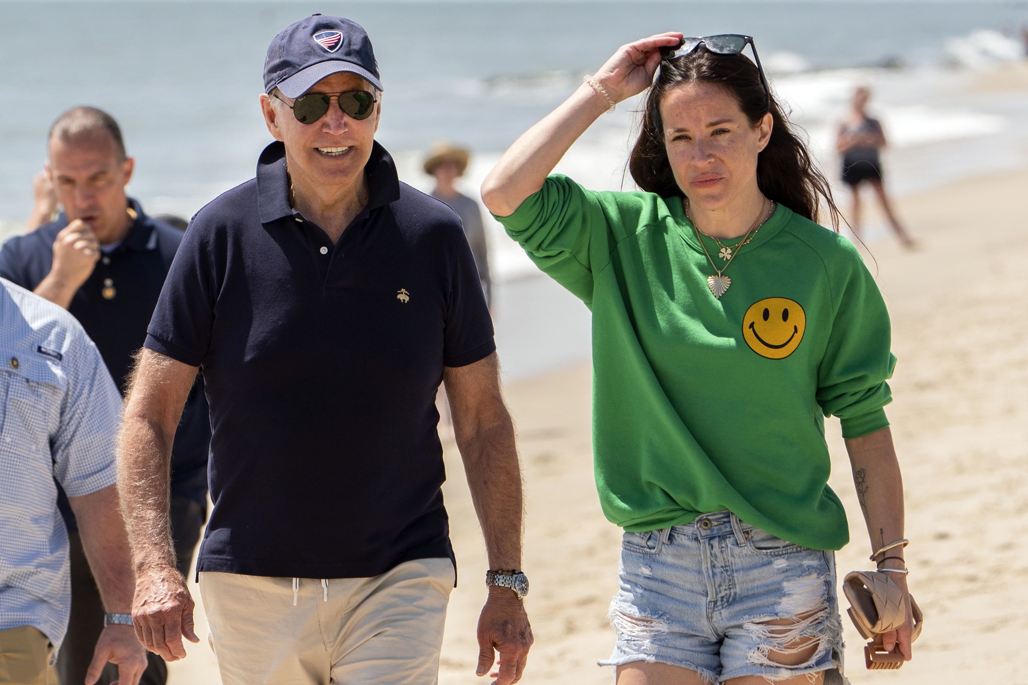 President Joe Biden walks on the beach with daughter Ashley Biden