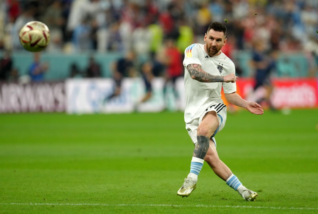 Lionel Messi kicks a ball during warm-ups before the FIFA World Cup semifinal between Argentina and Croatia.