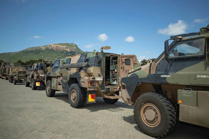 Army vehicles lined up.