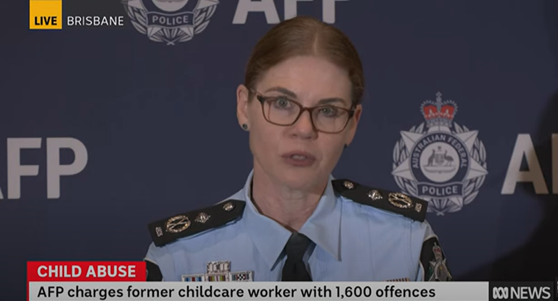 A police woman giving a press conference