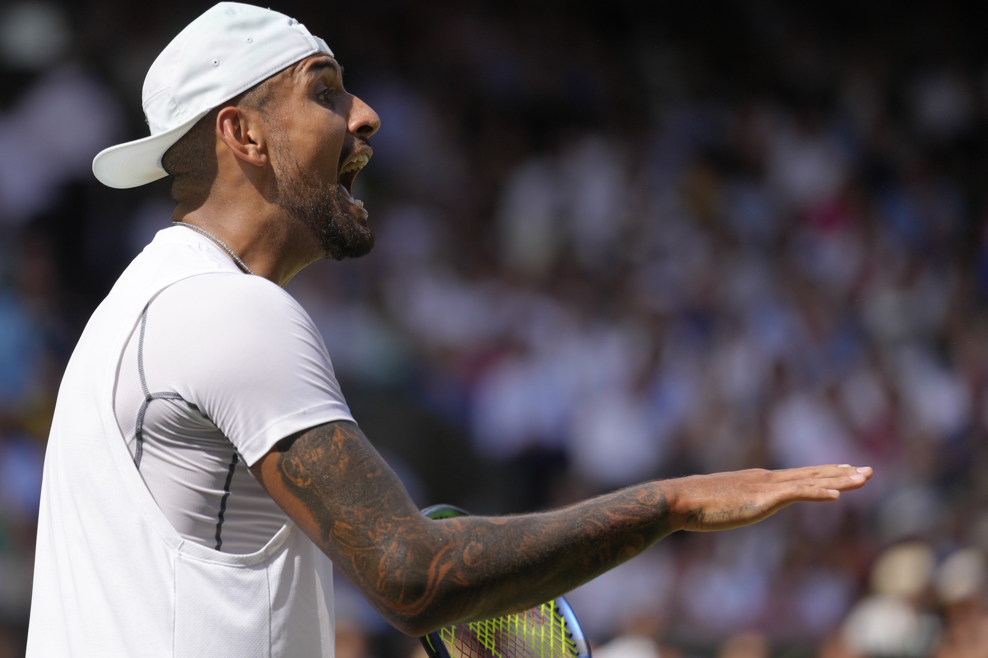 Nick Kyrgios shouts and gesticulates during the Wimbledon final.