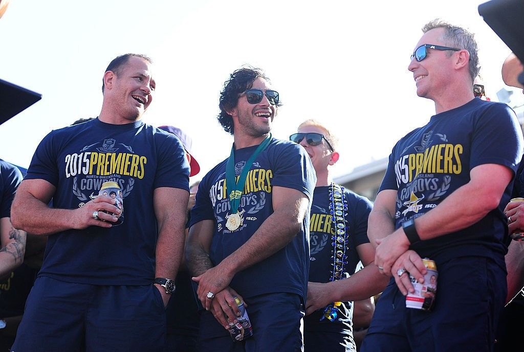 Johnathan Thurston, Matthew Scott and Paul Green of the Cowboys share a laugh with the crowd whilst standing on stage during the North Queensland Cowboys NRL Grand Final fan day