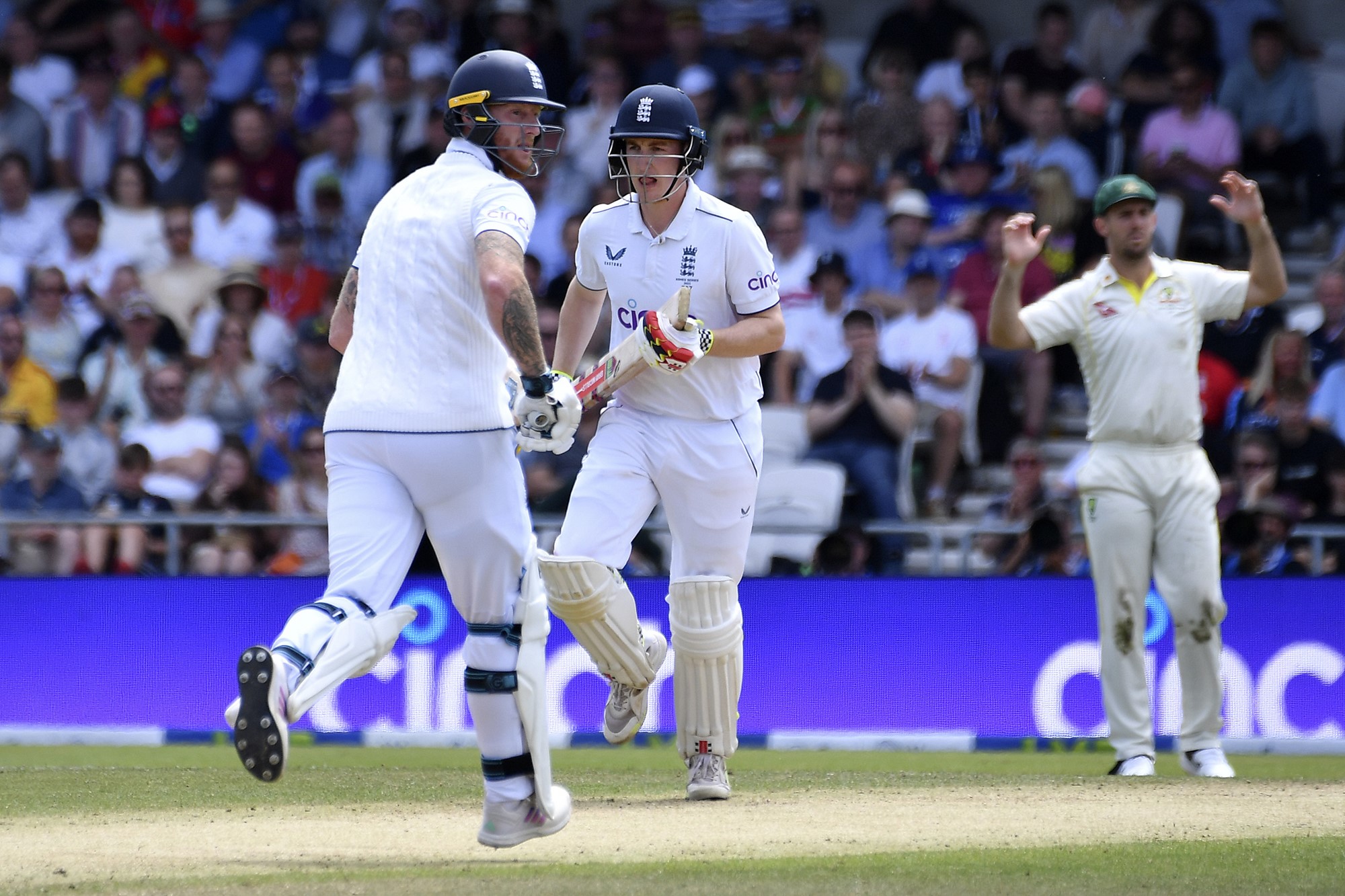 ENgland batters Ben Stokes and Harry Brook run between the wickets in an Ashes Test.