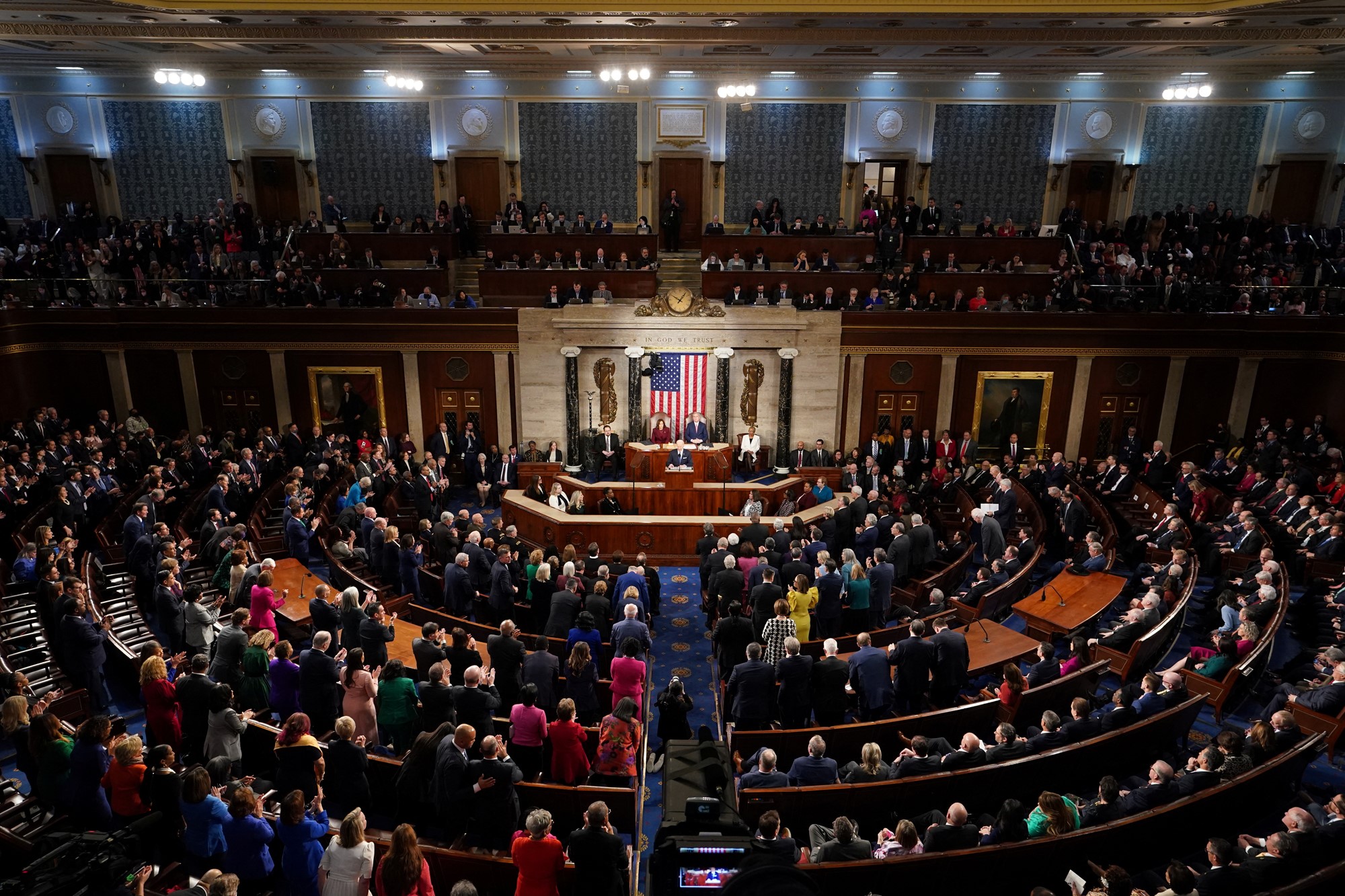 A wide shot of Congress on their feet clapping for Biden.