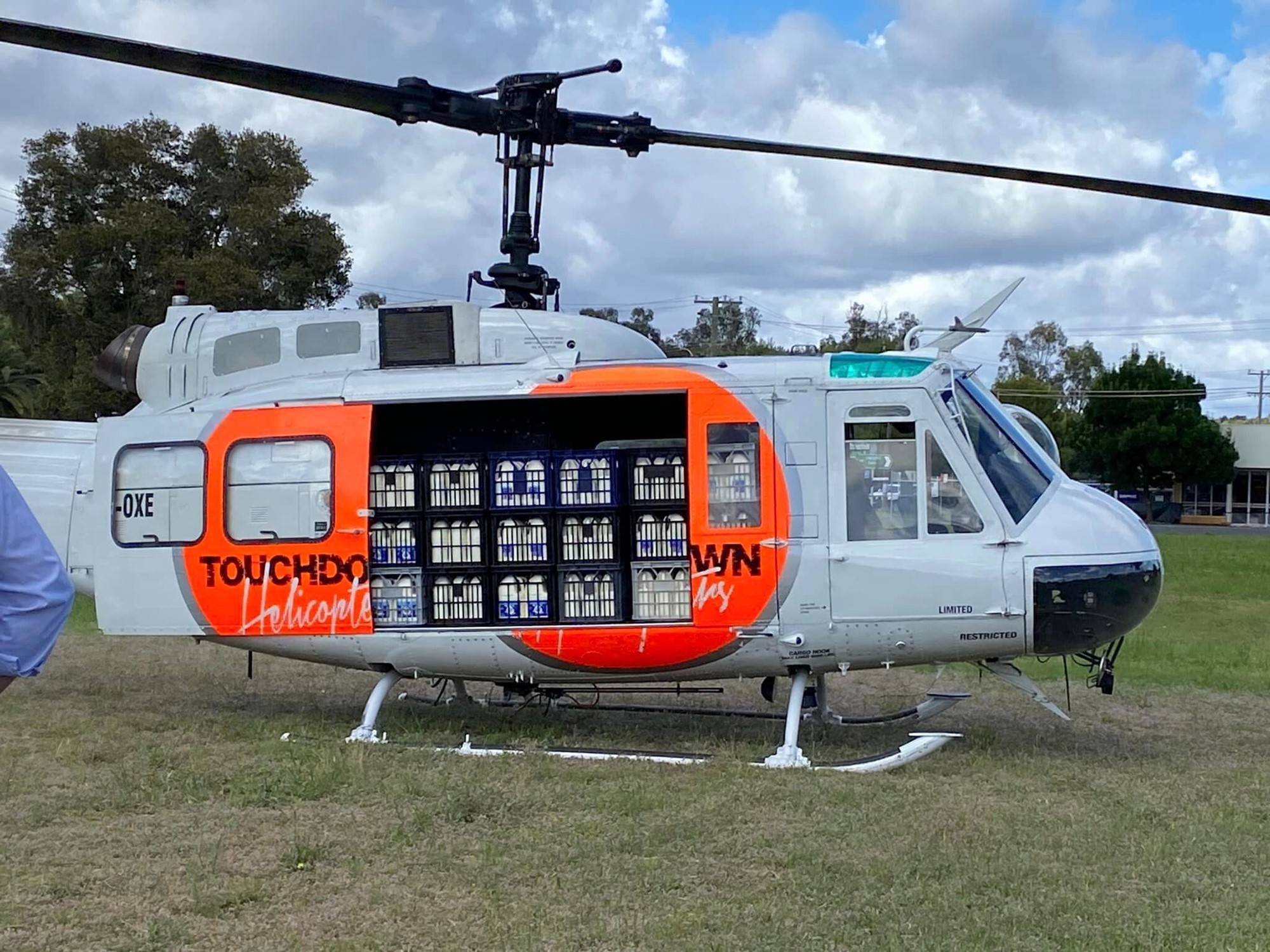 A helicopter loaded up with crates of milk