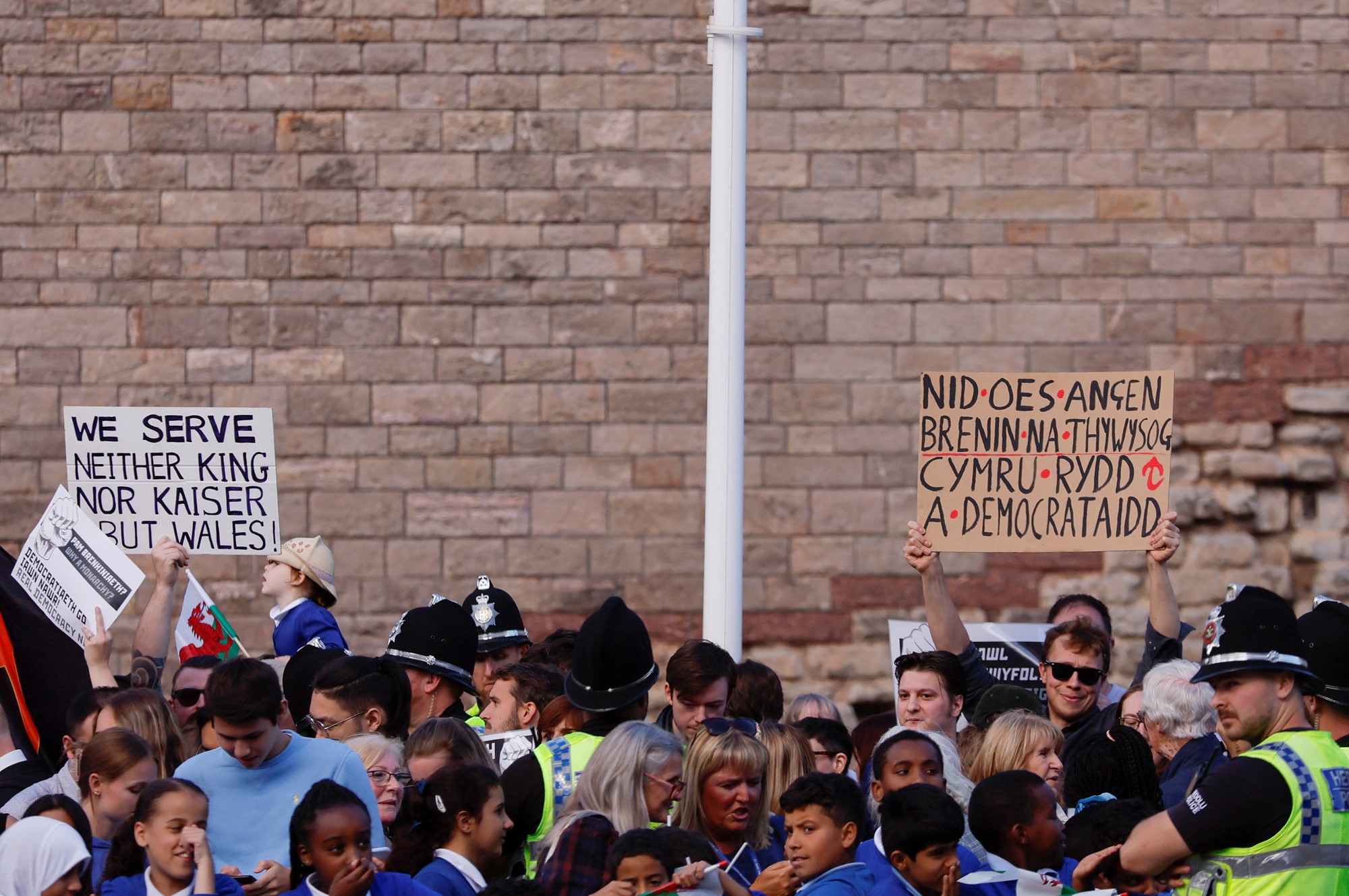 People holding anti-monarchy signs.