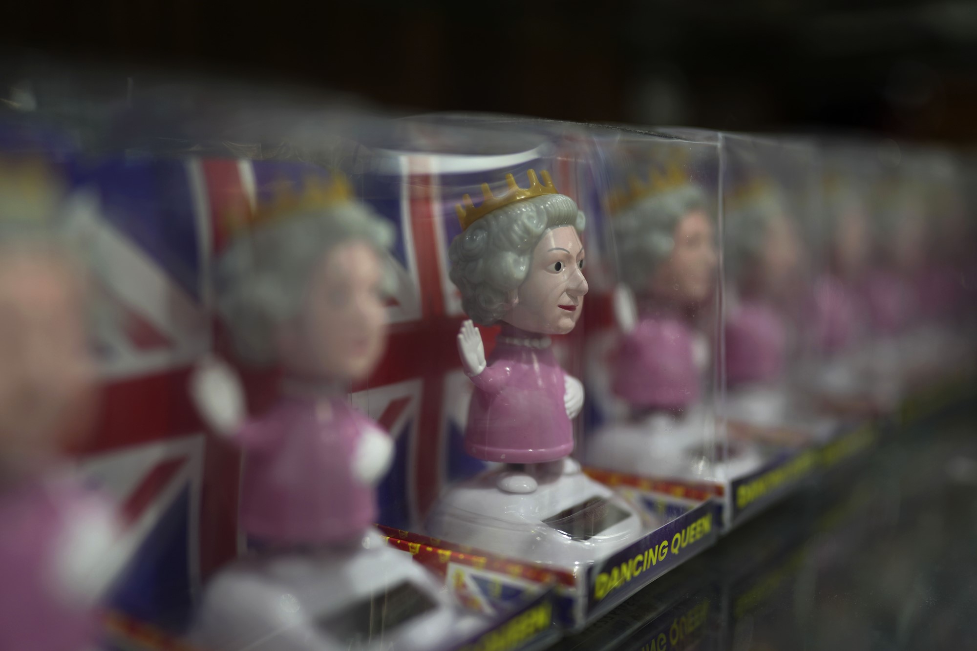 Toy figures of Queen Elizabeth II are displayed for sale at a gift shop in London, Monday, Sept. 12, 2022