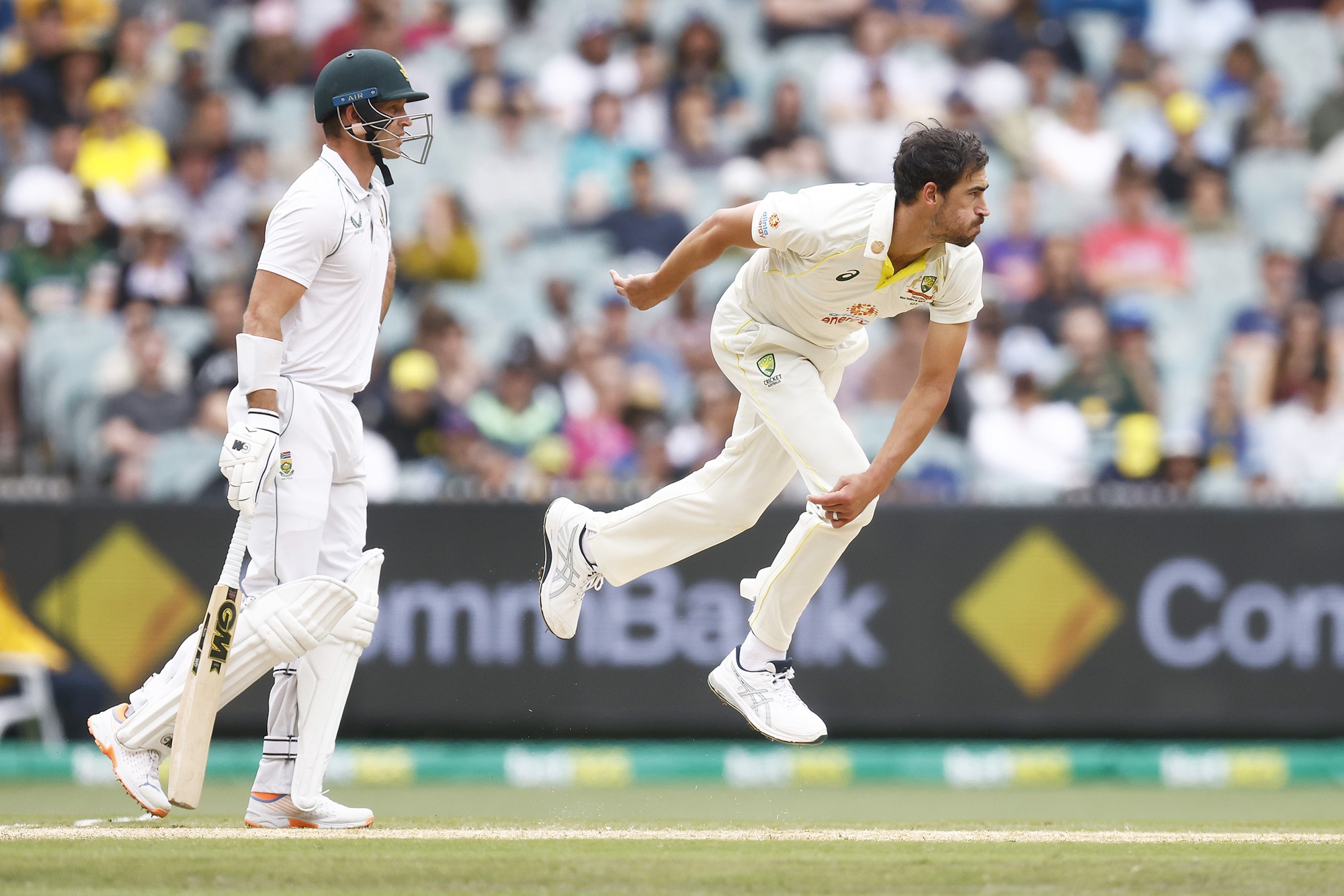 Mitchell Starc completes his bowling action during a Test against South Africa.