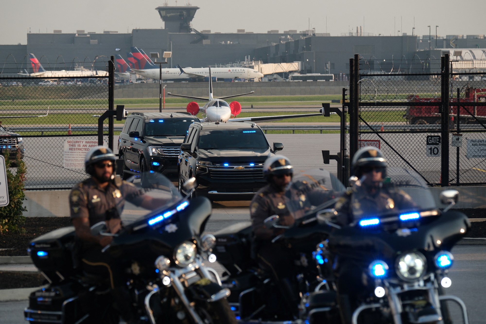 Members of security forces ride motorcycles as former U.S. President Donald Trump departs Atlanta Hartsfield-Jackson International Airport
