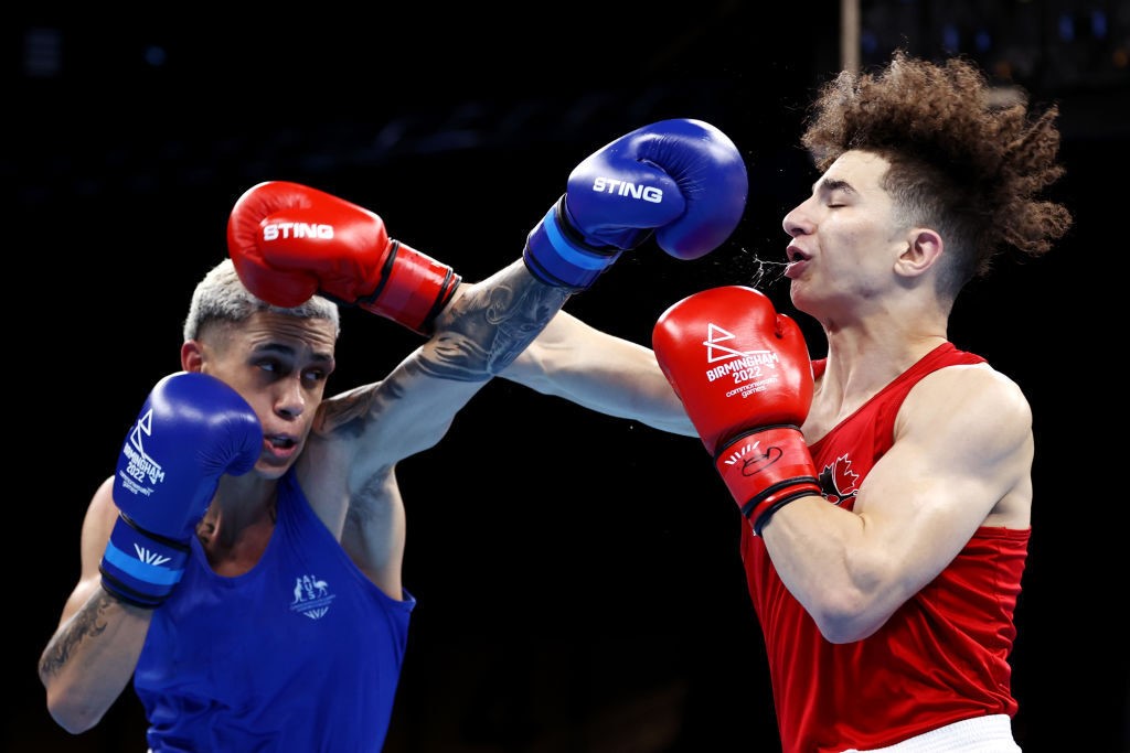 two boxers in action throwing punches