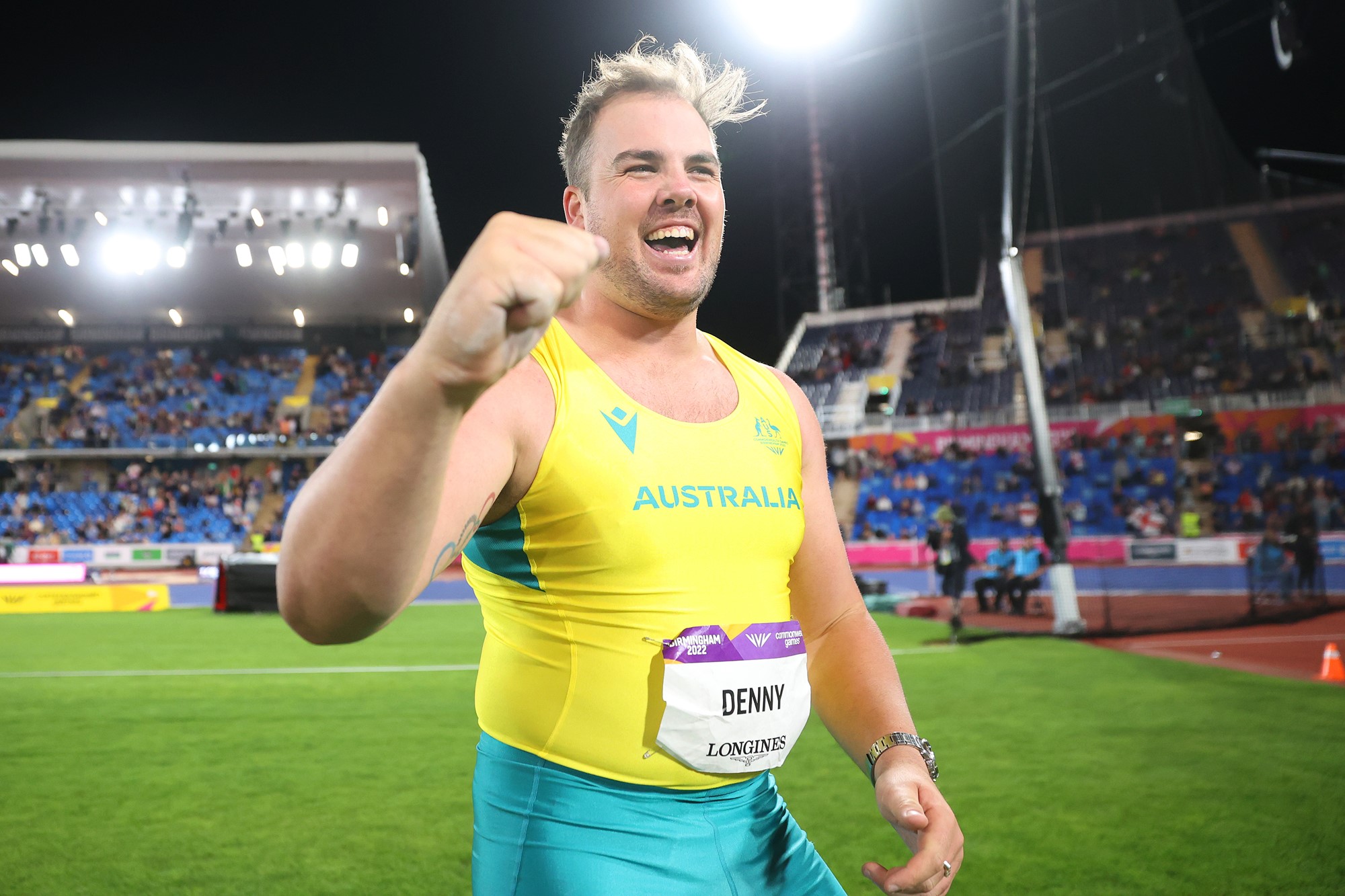 Matthew Denny clenches a fist after winning Commonwealth Games gold in the discus.