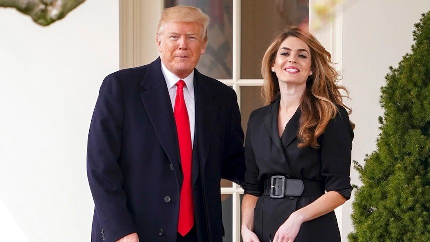 Donald Trump stands with Hope Hicks.