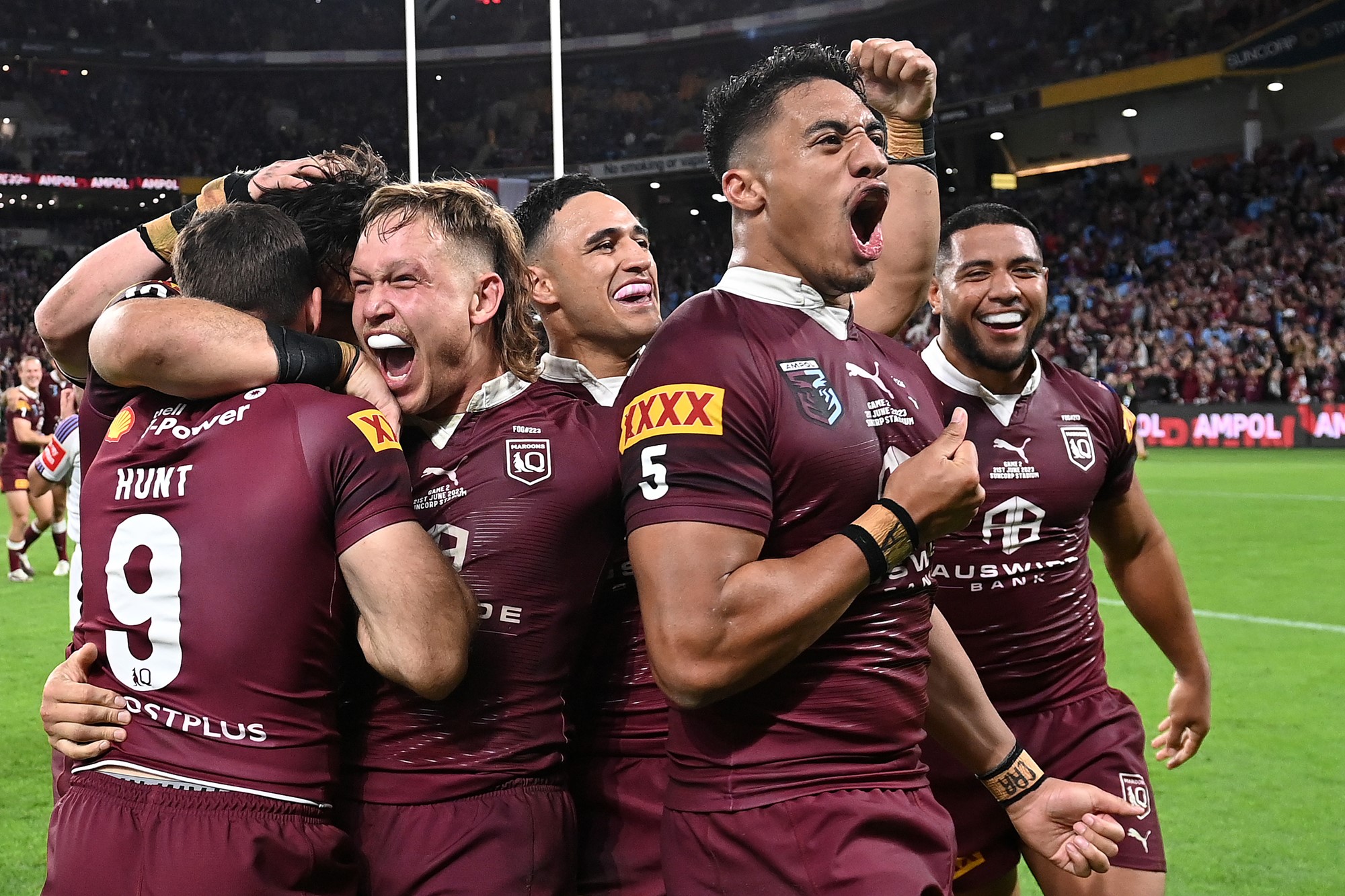 Murray Taulagi and the Queensland Maroons celebrate a State of Origin series victory.