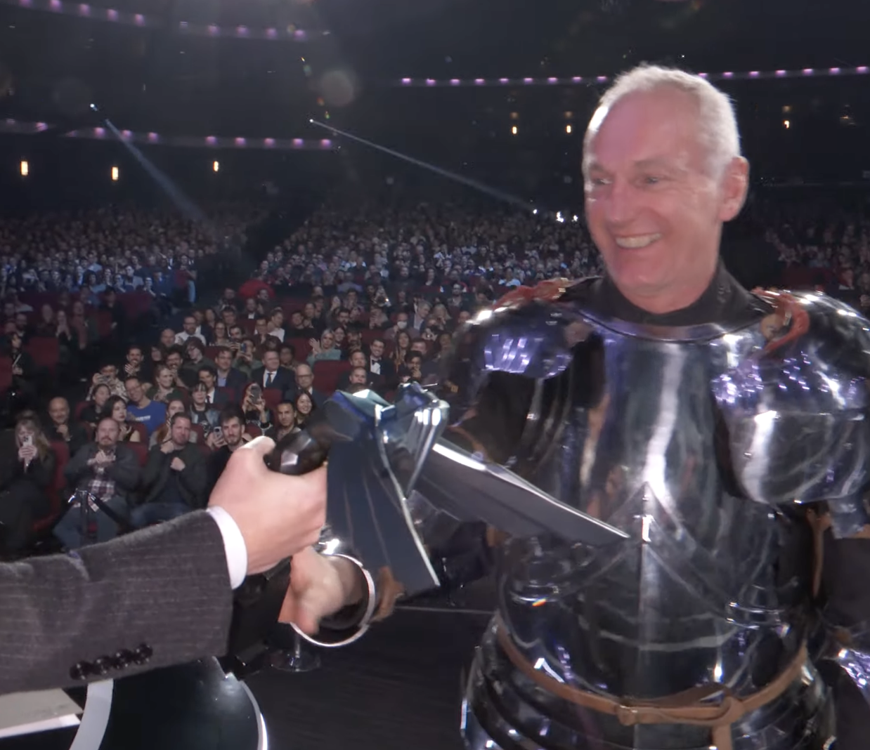 A man accepts an award on stage at the Game Awards